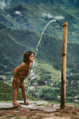 Child Drinks Water from Well, Nepal, 1983