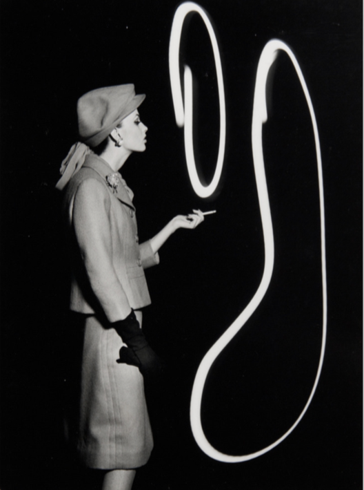 Dorothy Blowing Light Smoke Rings, Paris, 1962.